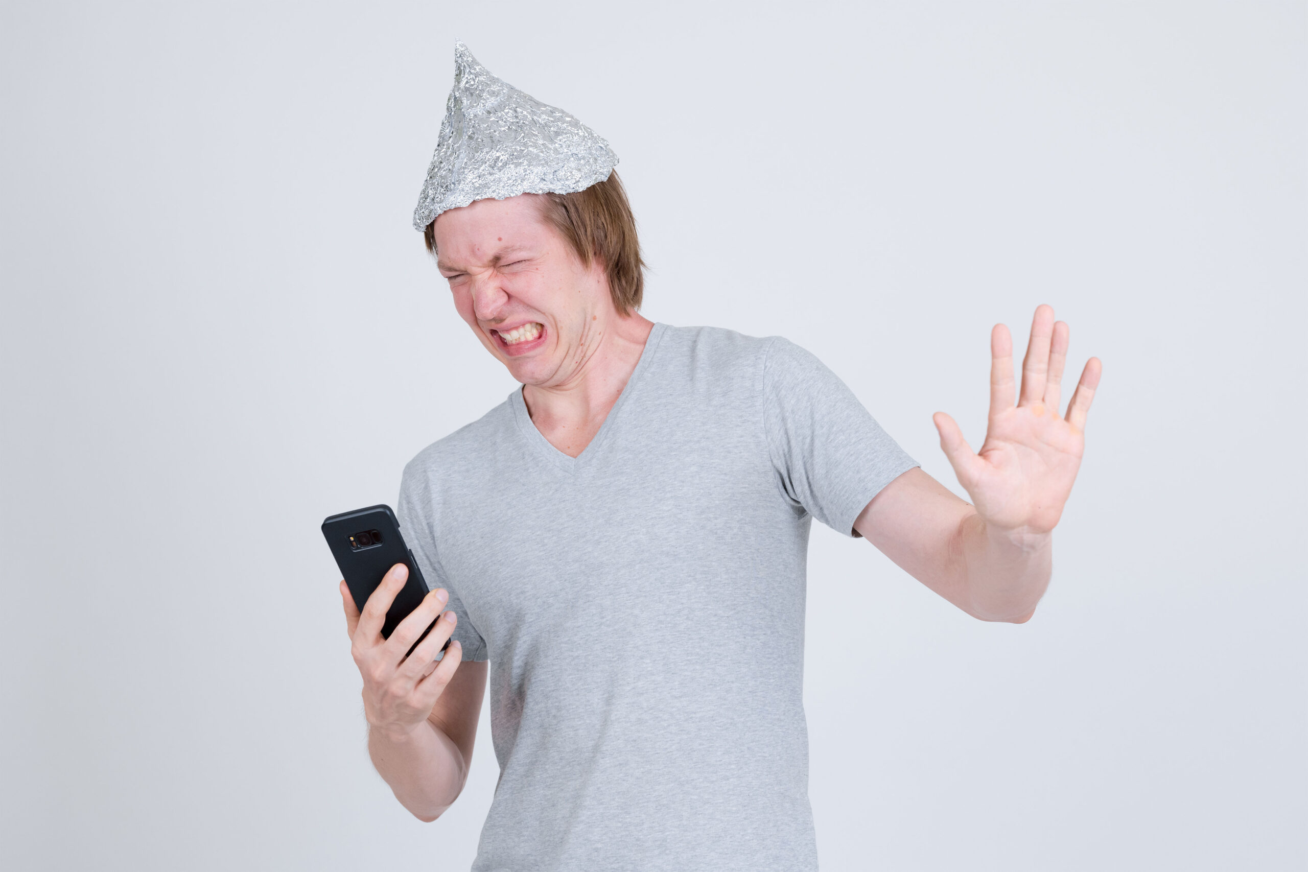 Young man wearing a tin foil hat